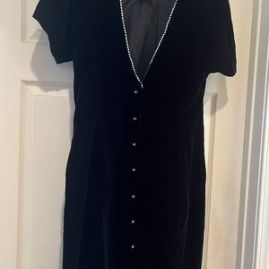 I am selling a Black Evening Dress below the knees.